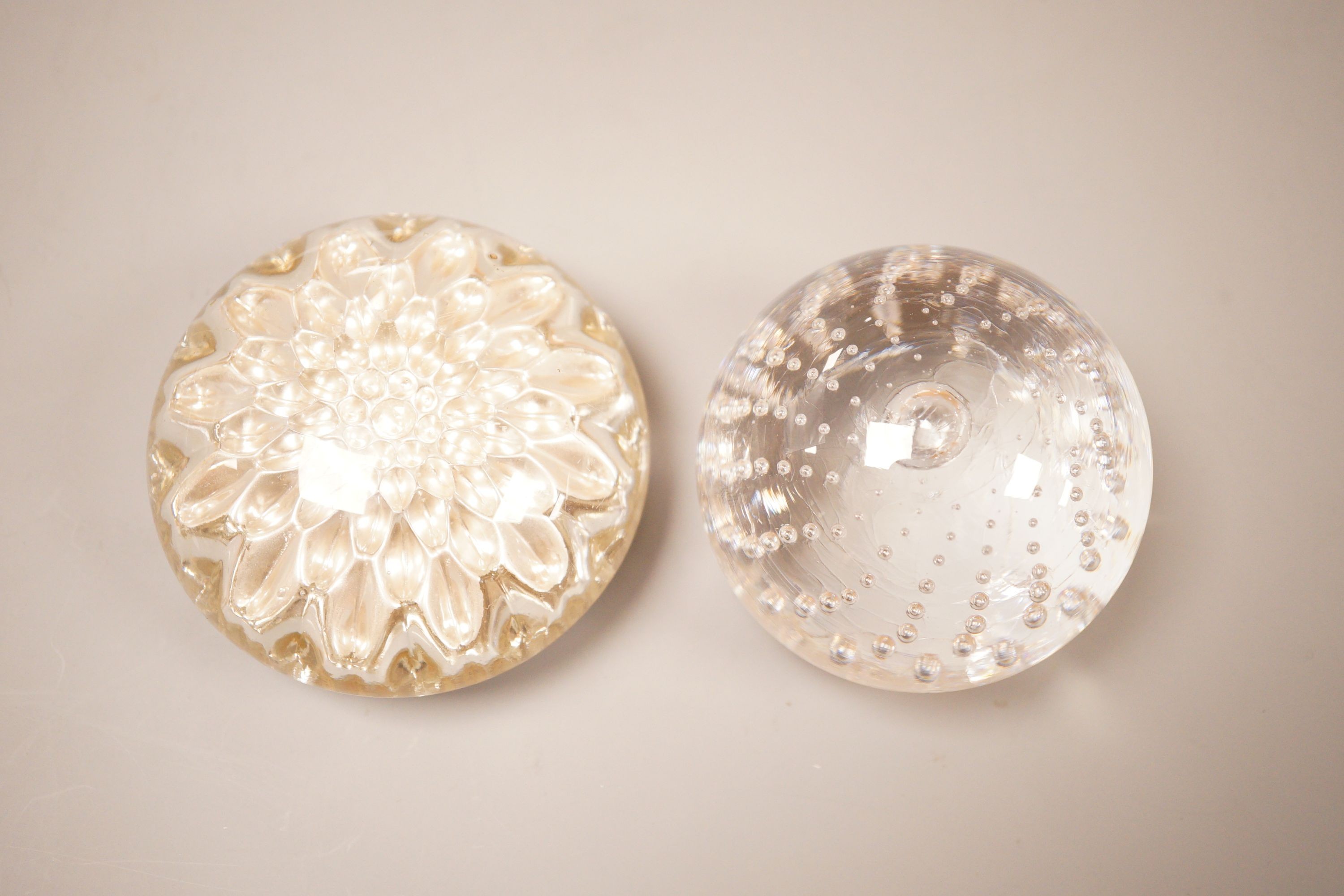 A early 20th century French glass paperweight together with another